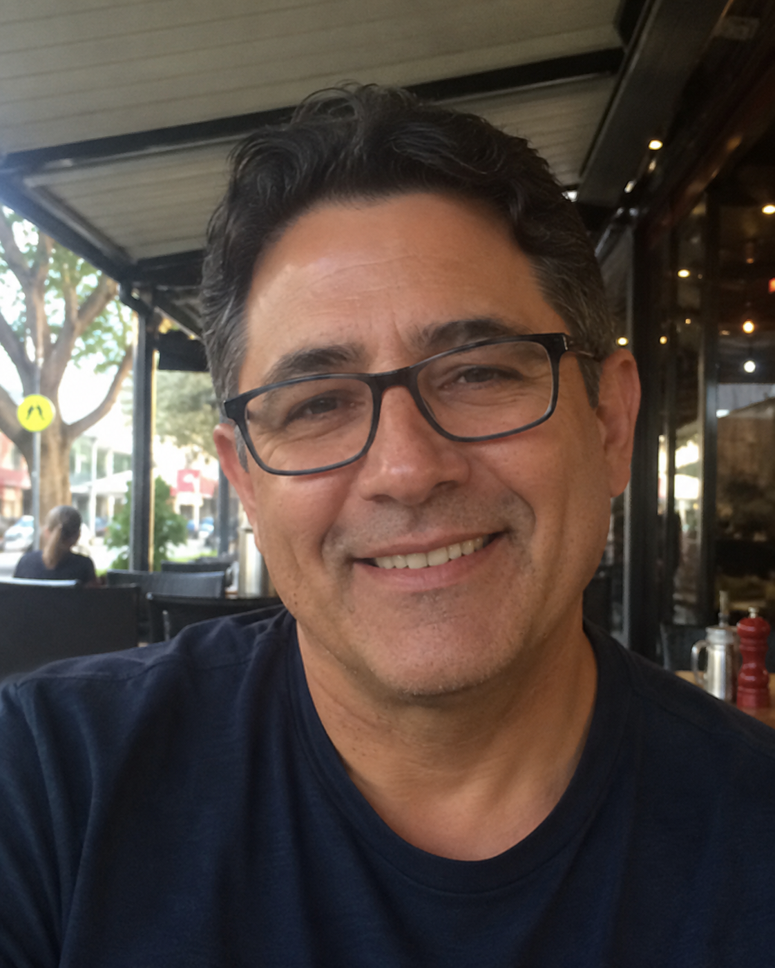 Illustrative lifestyle image of a man at a café